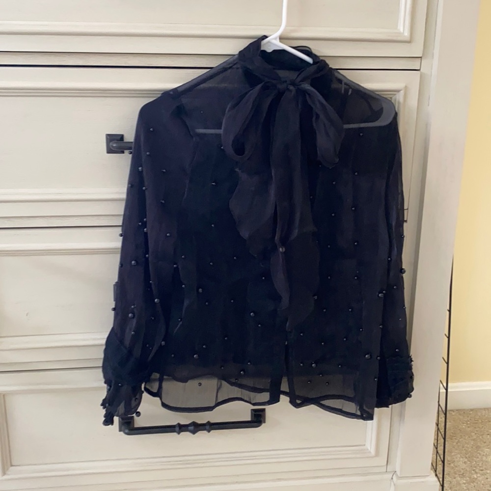 Dark pretty shirt. Very lady-like style